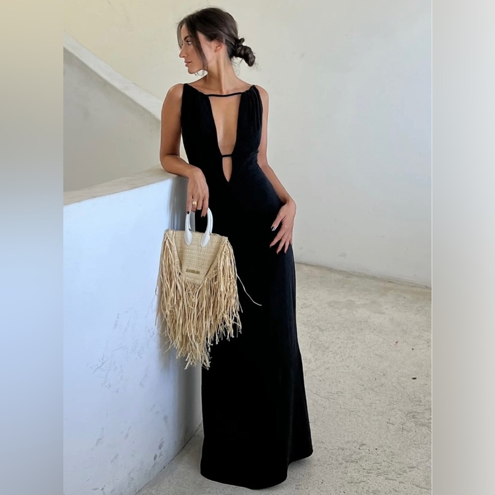 Brand New with tags KAOA black v-neck dress in size Small color Black.